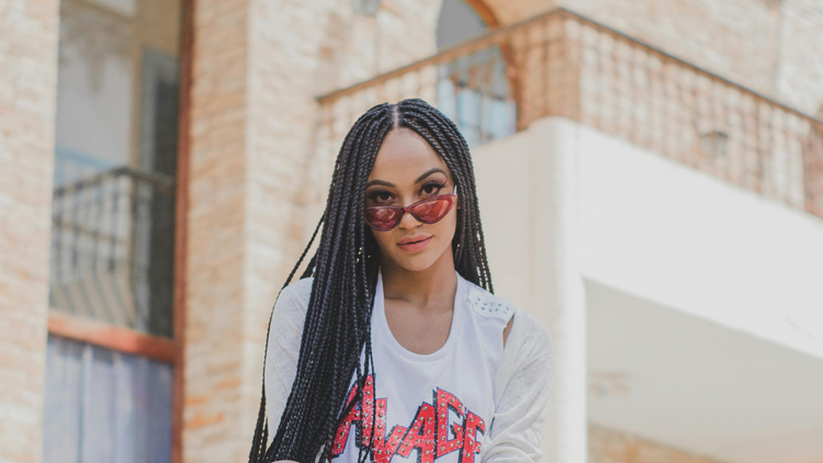 Girl with braids sitting on steps