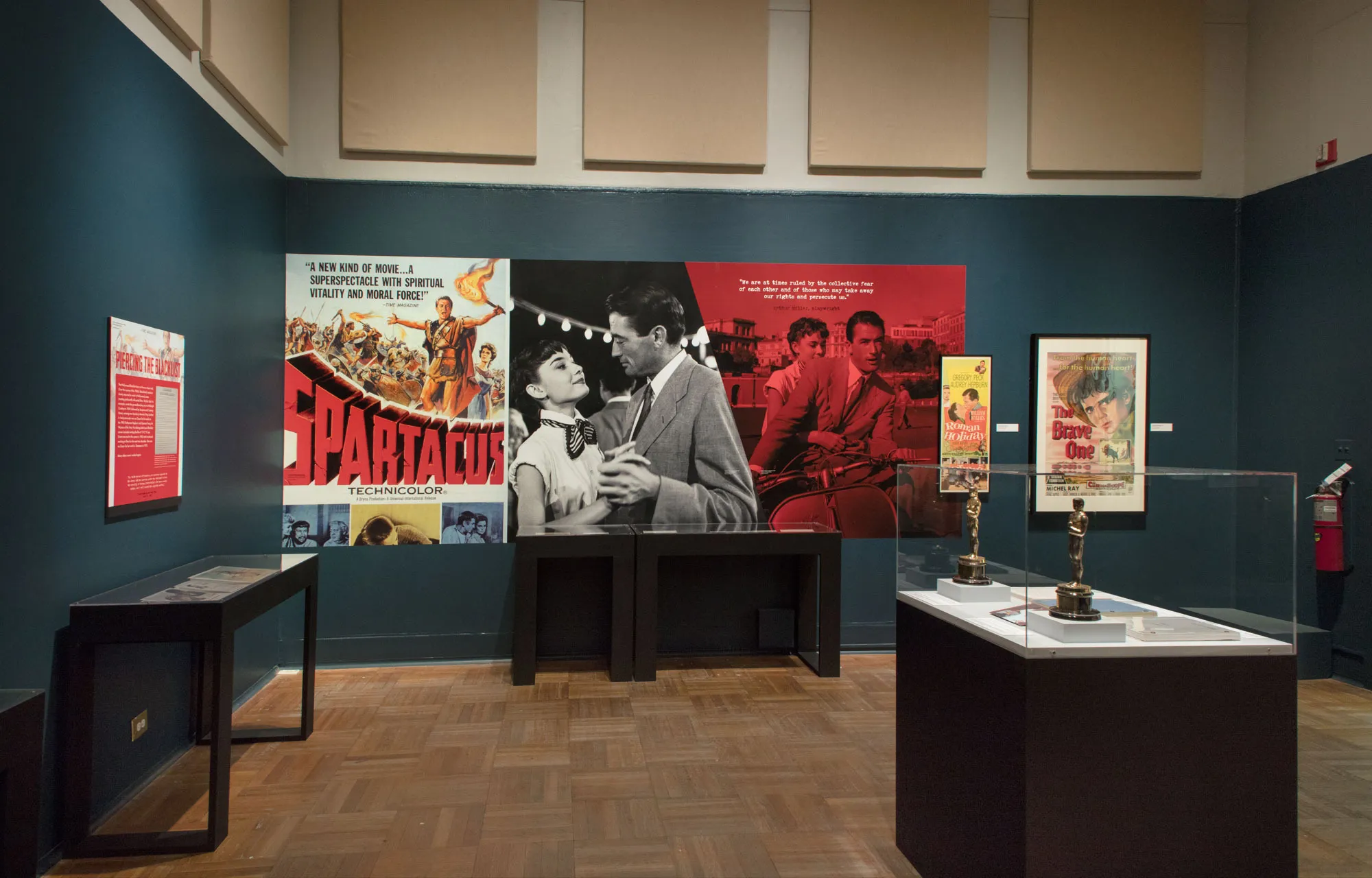 Academy Awards and movie posters at an exhibit.