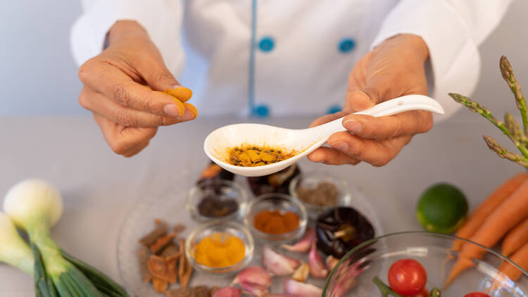 Close-up of chef hand in the kitchen