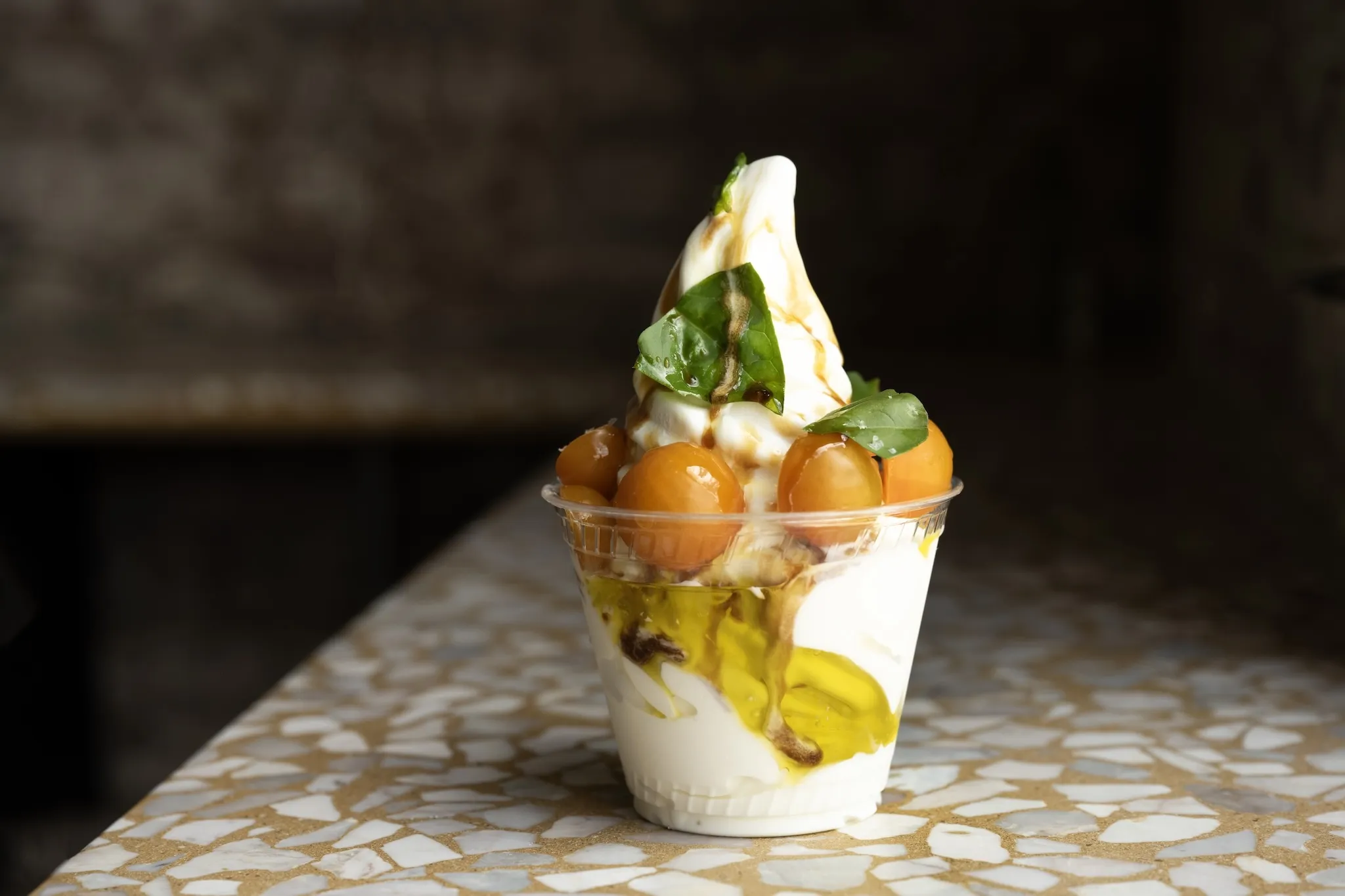 An ice cream with sungold tomatoes and olive oil