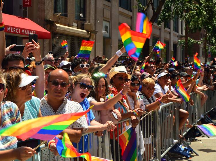 Spectators cheer on the participants of the World Pride parade in New York City and celebrate the contributions of the LBGT community