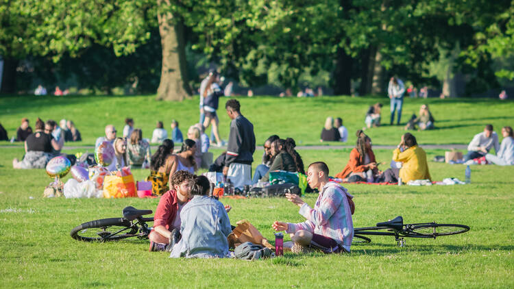 People enjoying the sun in a London park