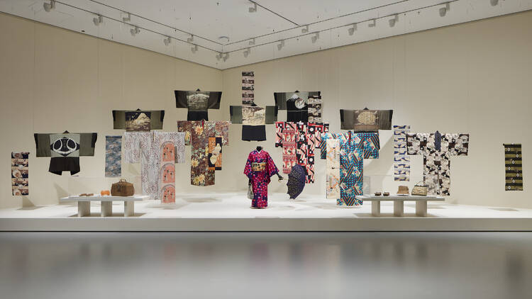 A white gallery space with kimonos on display.