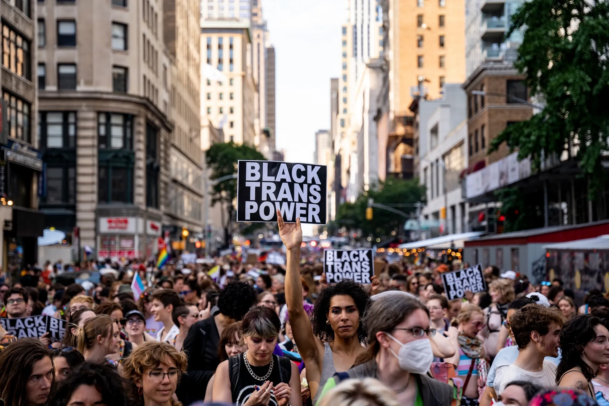 A person holds up a sign reading Black Trans Power at the 29th Annual NYC Dyke March