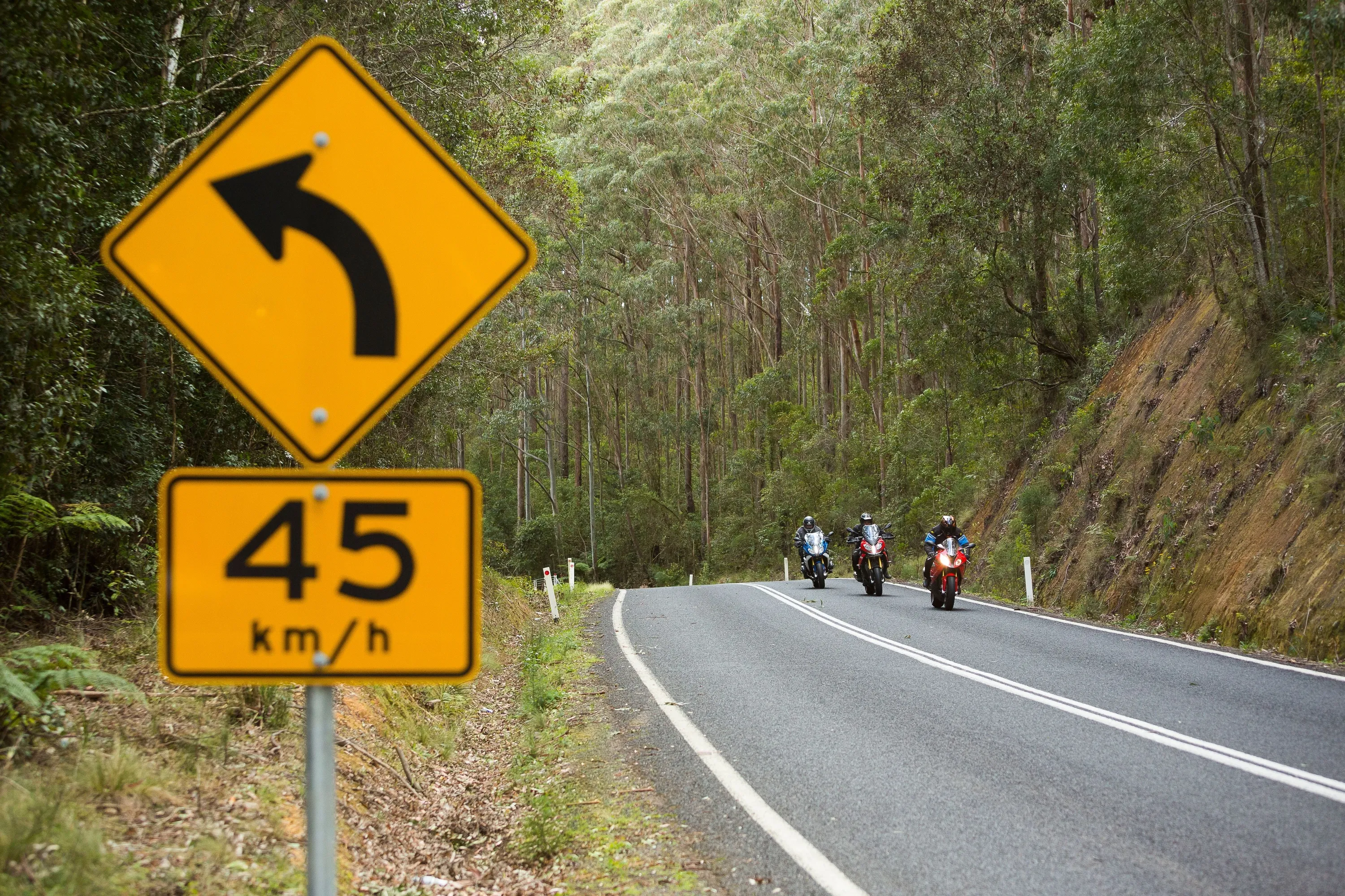 Motorcycle riders passing through Waterfall Way in the New England region.