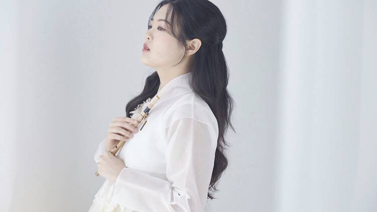 woman in white with long black hair woman in white with long black hair