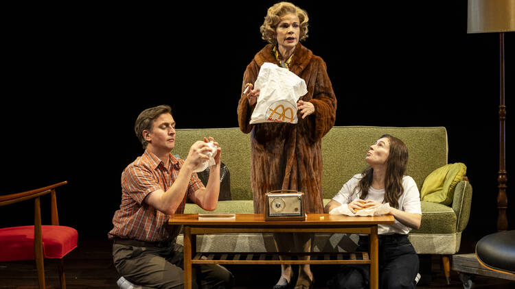 A scene from 'Mother Play' with all three cast members on a couch.