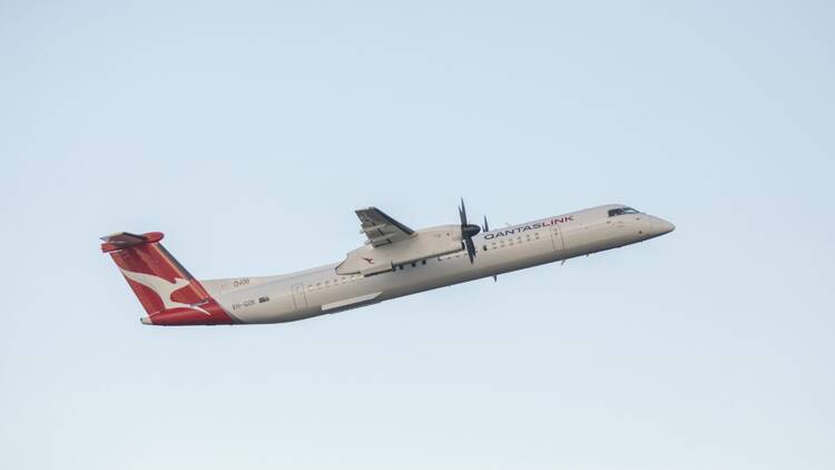 Qantaslink Q400 bombardier aircraft takeoff at Sydney airport