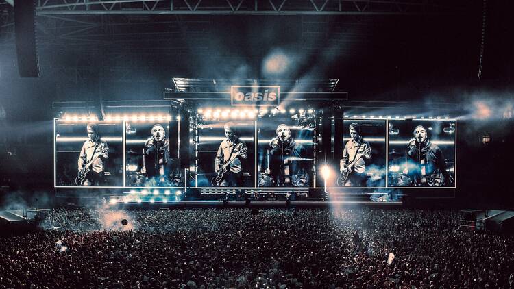 Oasis performing live in Cardiff, 2025