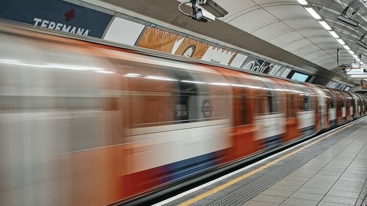 Bakerloo line train at Oxford Circus station in London