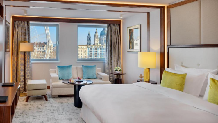 One of the rooms at Kempinski Hotel Corvinus with a view of the grand ferris wheel 