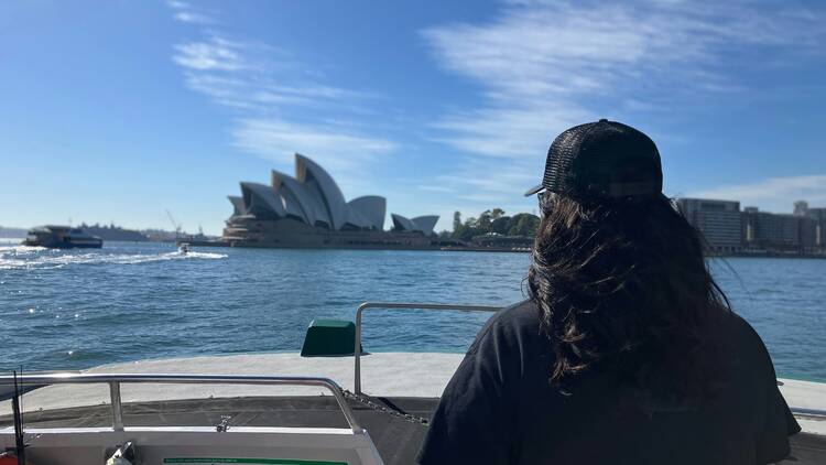 Girl on ferry approaching Sydney Opera House