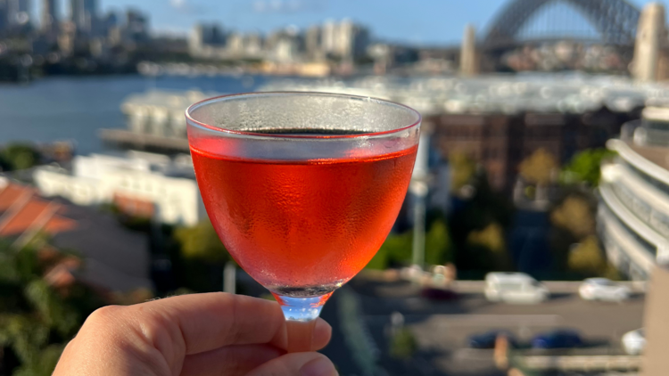 Avril holding a cocktail at Henry Deane