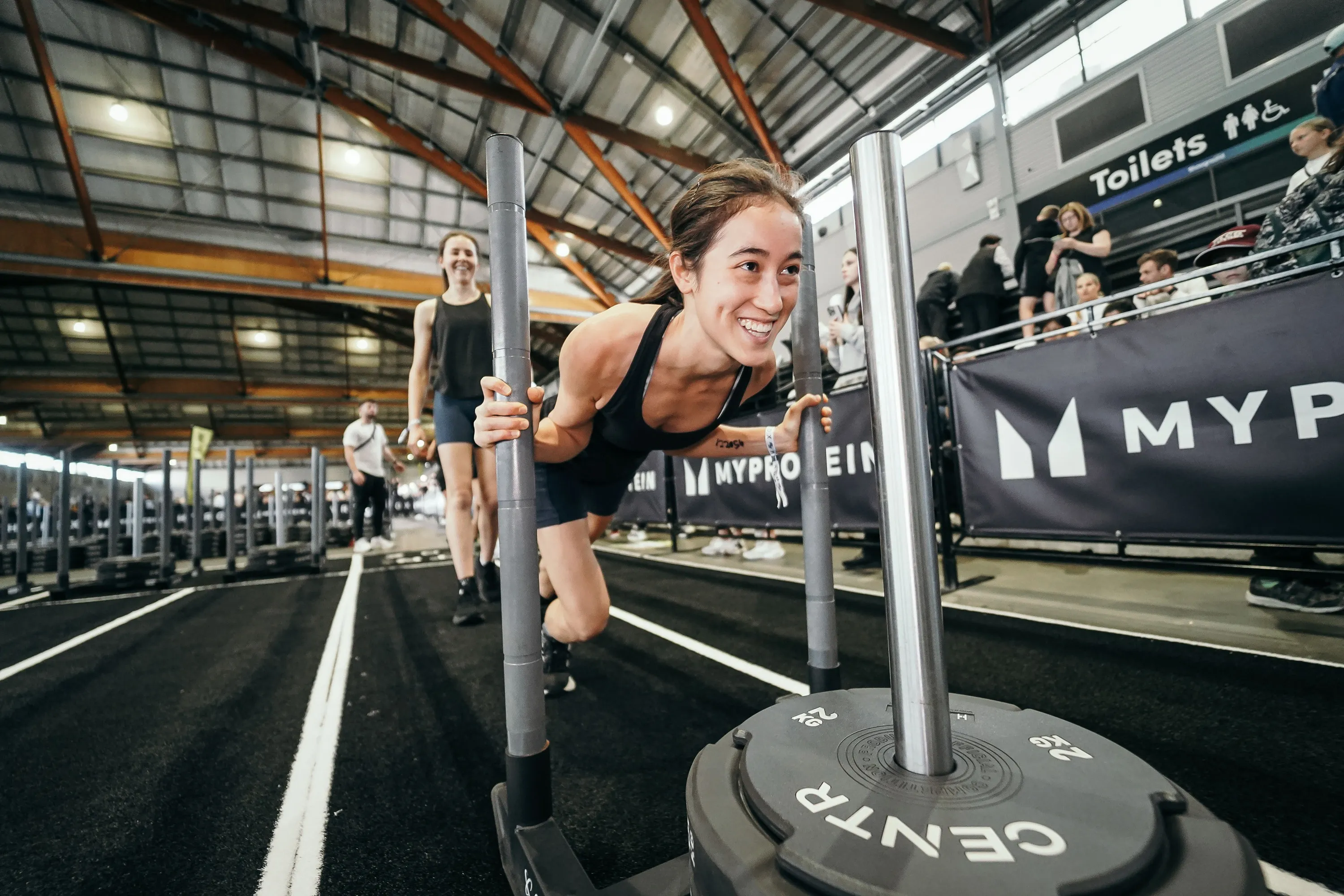 Girl pushing sled