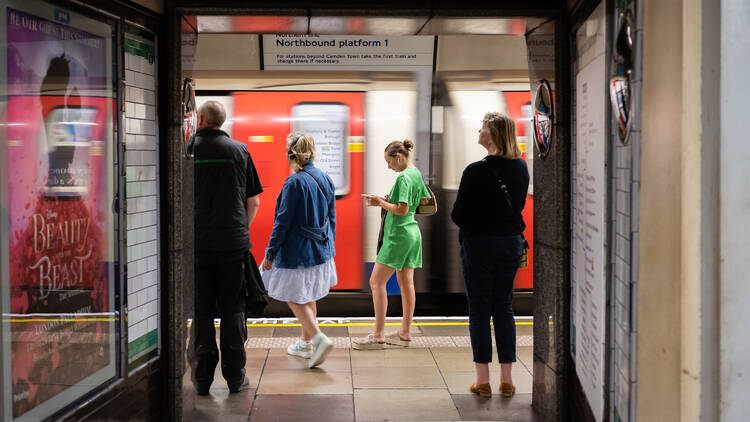 Tooting Bec station on London’s Northern line, with a customer on the phone