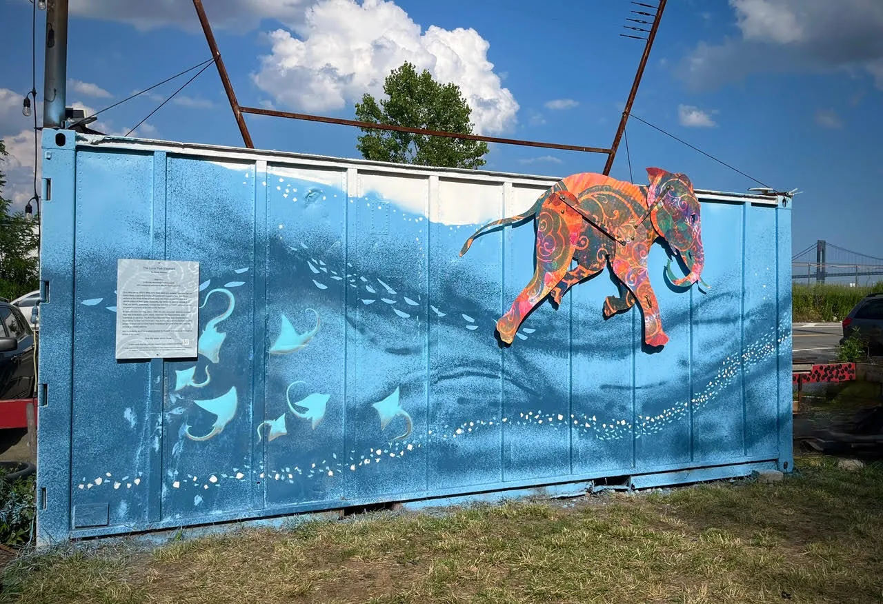 Colorful elephant puppet against blue sparkling background