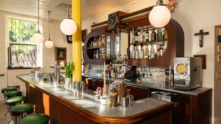 A curved bar with globes