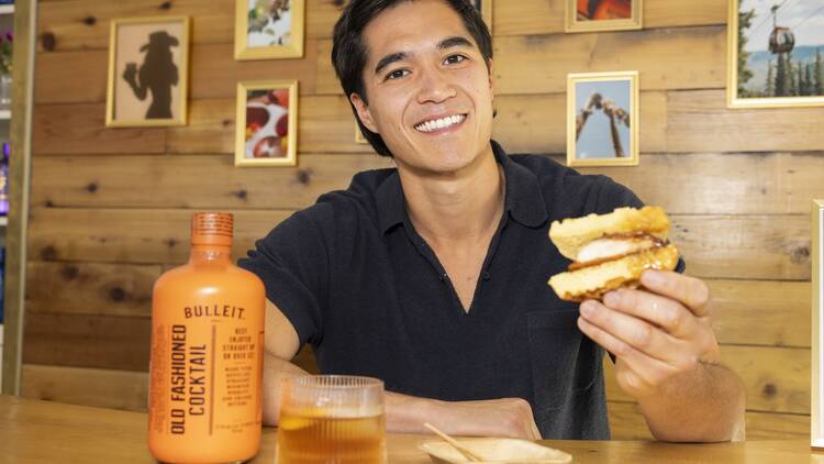 Owen Han holding a sandwich