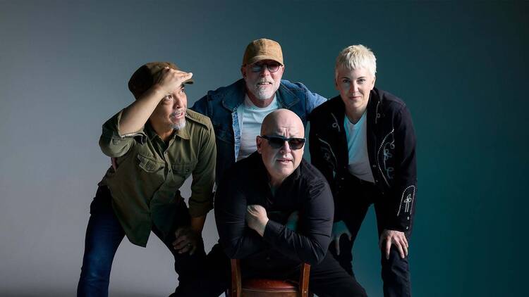 Four men crouching down Four men crouching down