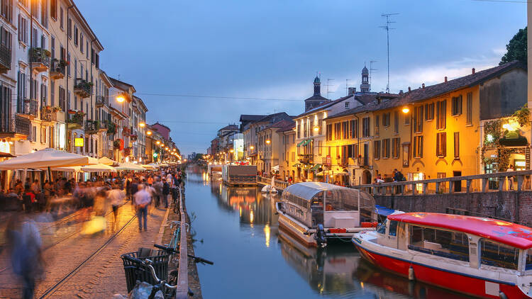Evening scene along the Naviglio Grande canal in Milan, Italy.