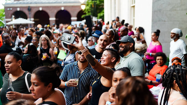 People snap a selfie during a group event.