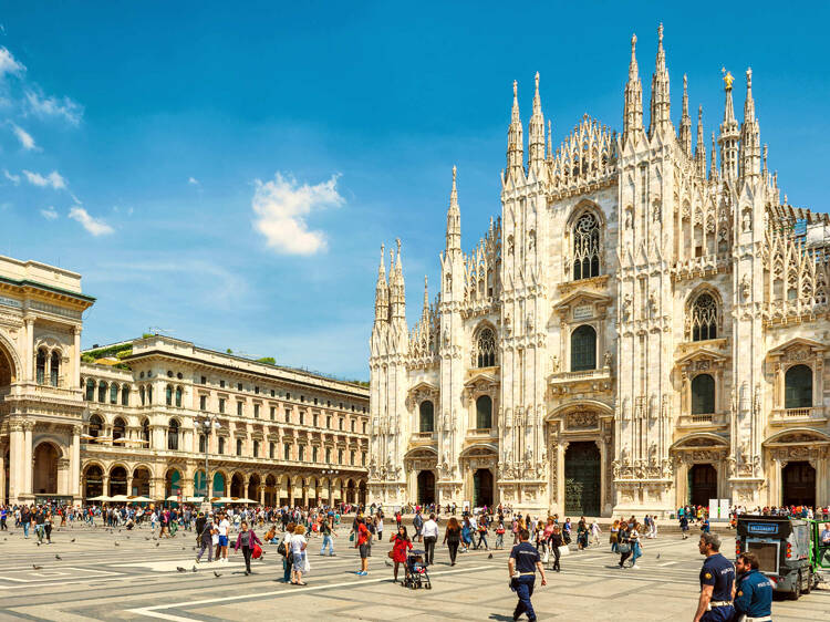 Panorama of Piazza del Duomo, main square of Milan, Italy. Famous Milan Cathedral in center of Milano city. It is top tourist attraction of Milan, World landmark.