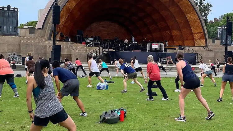 people exercising outside in front of Hatch Shell people exercising outside in front of Hatch Shell