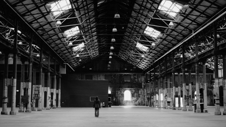 Person standing in a warehouse