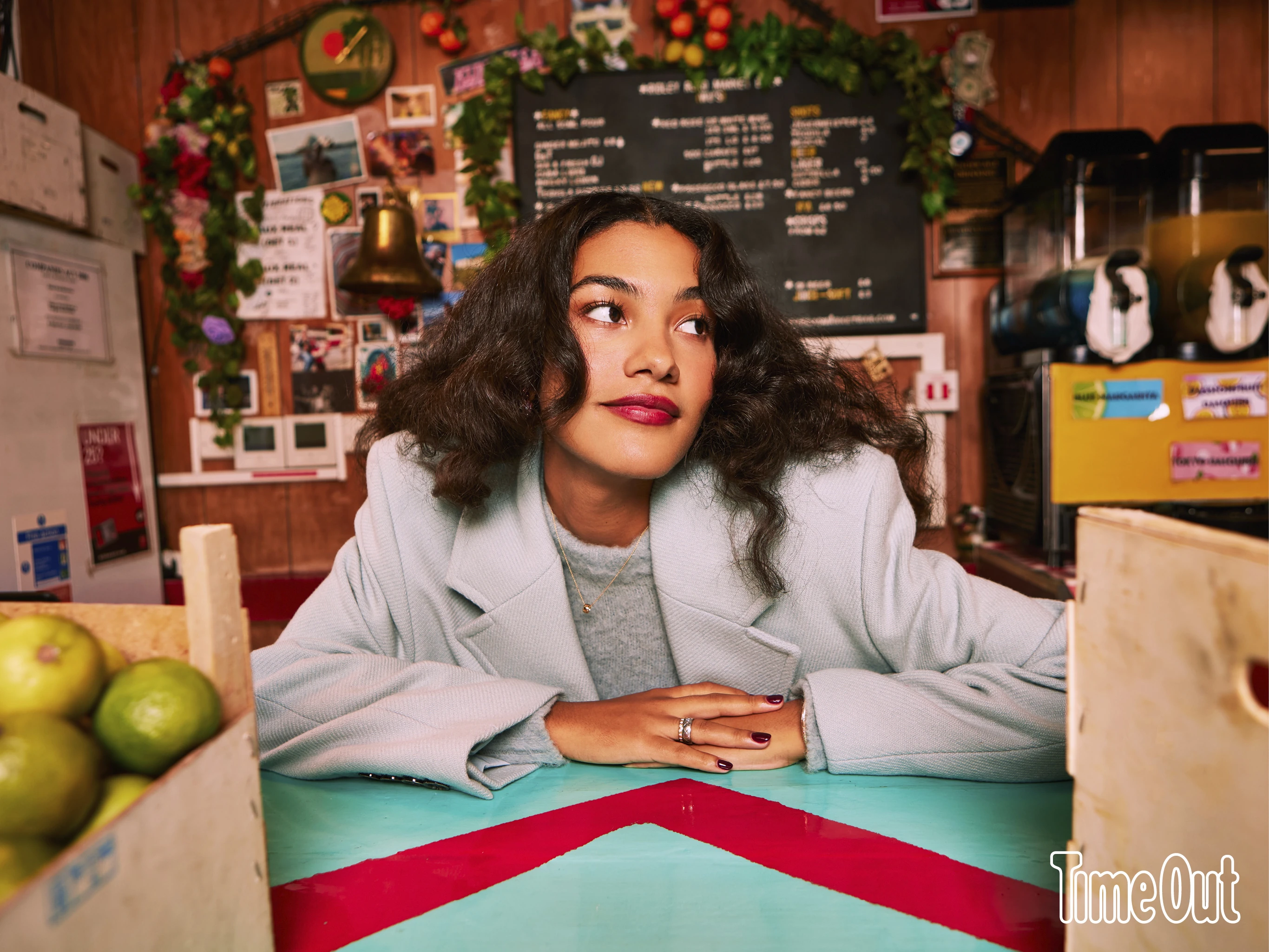 Olivia Dean behind the bar 