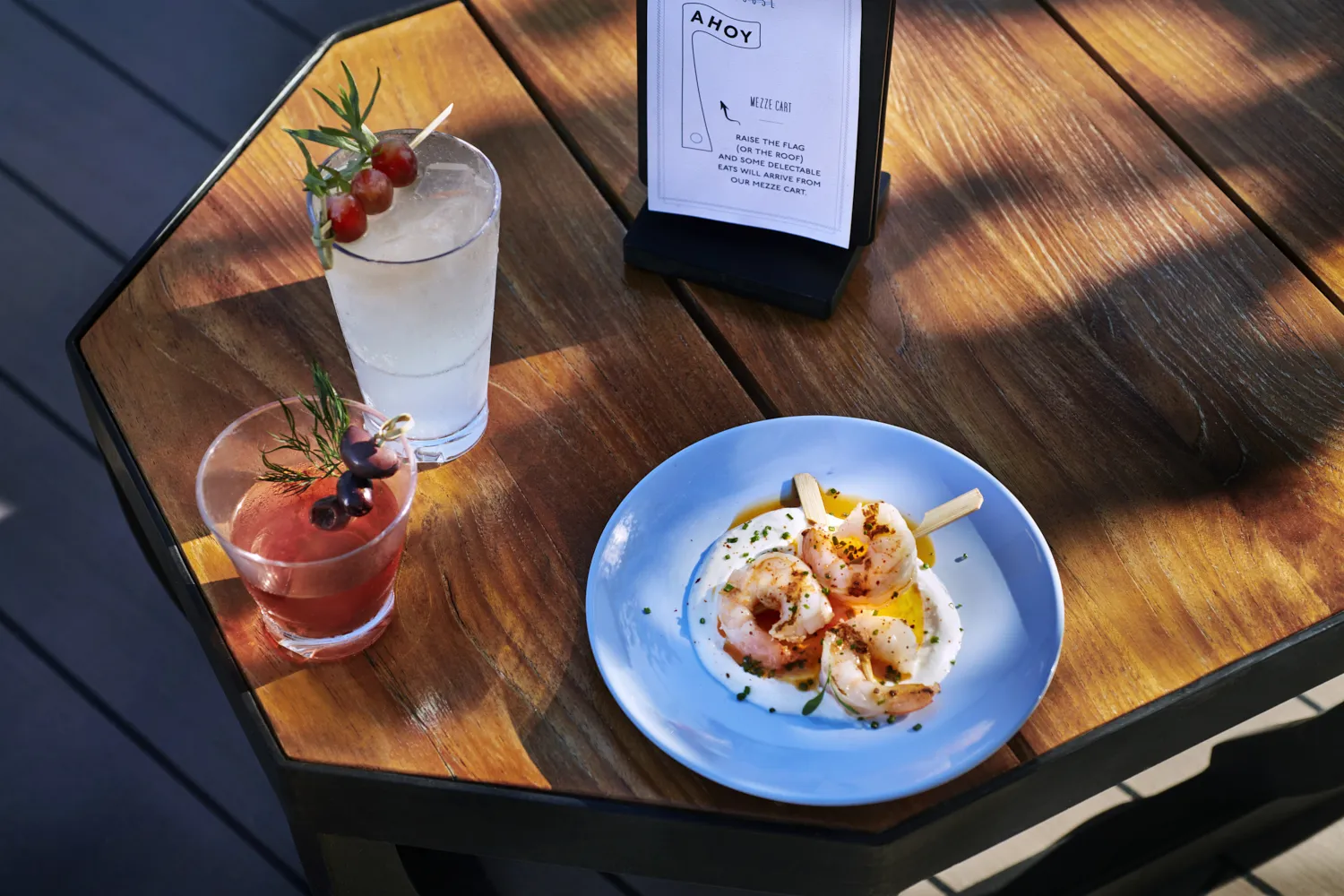 | Shrimp skewers and cocktails on a table at The Dock