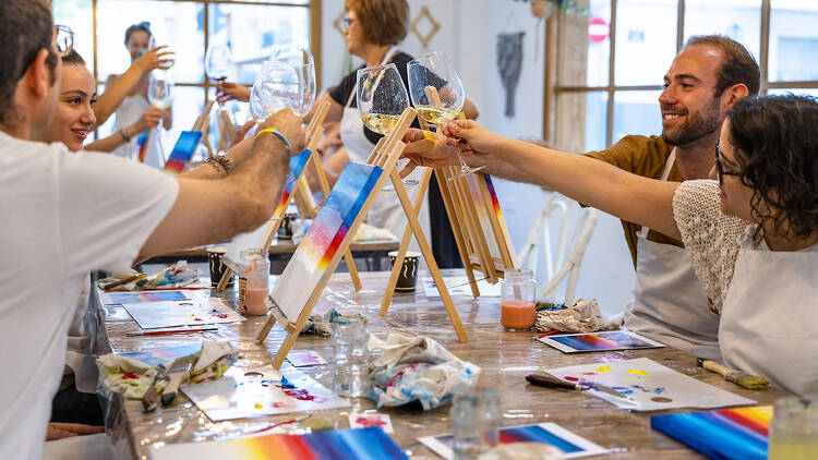 Friends at a sip and paint event.