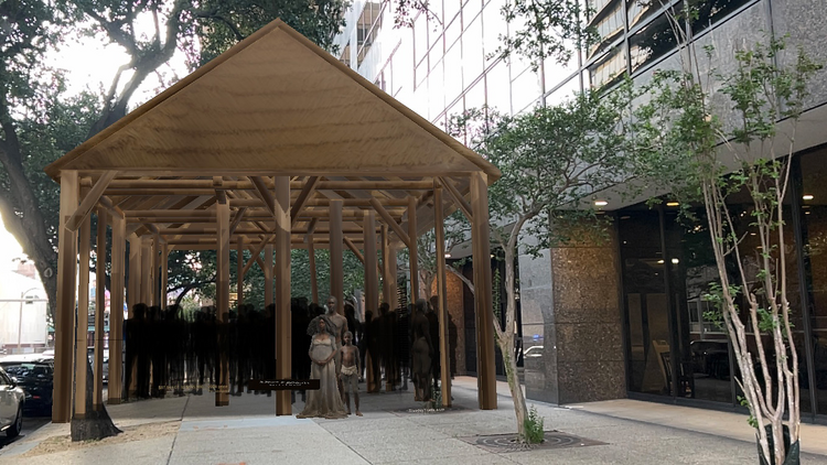 Statues of enslaved people underneath a hut
