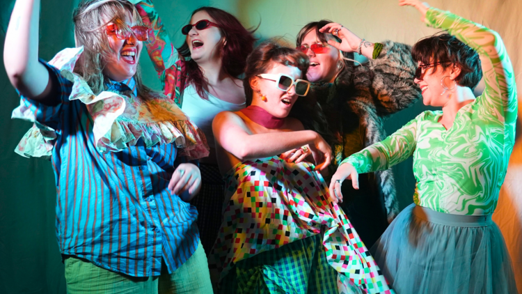 People in colourful costumes dancing