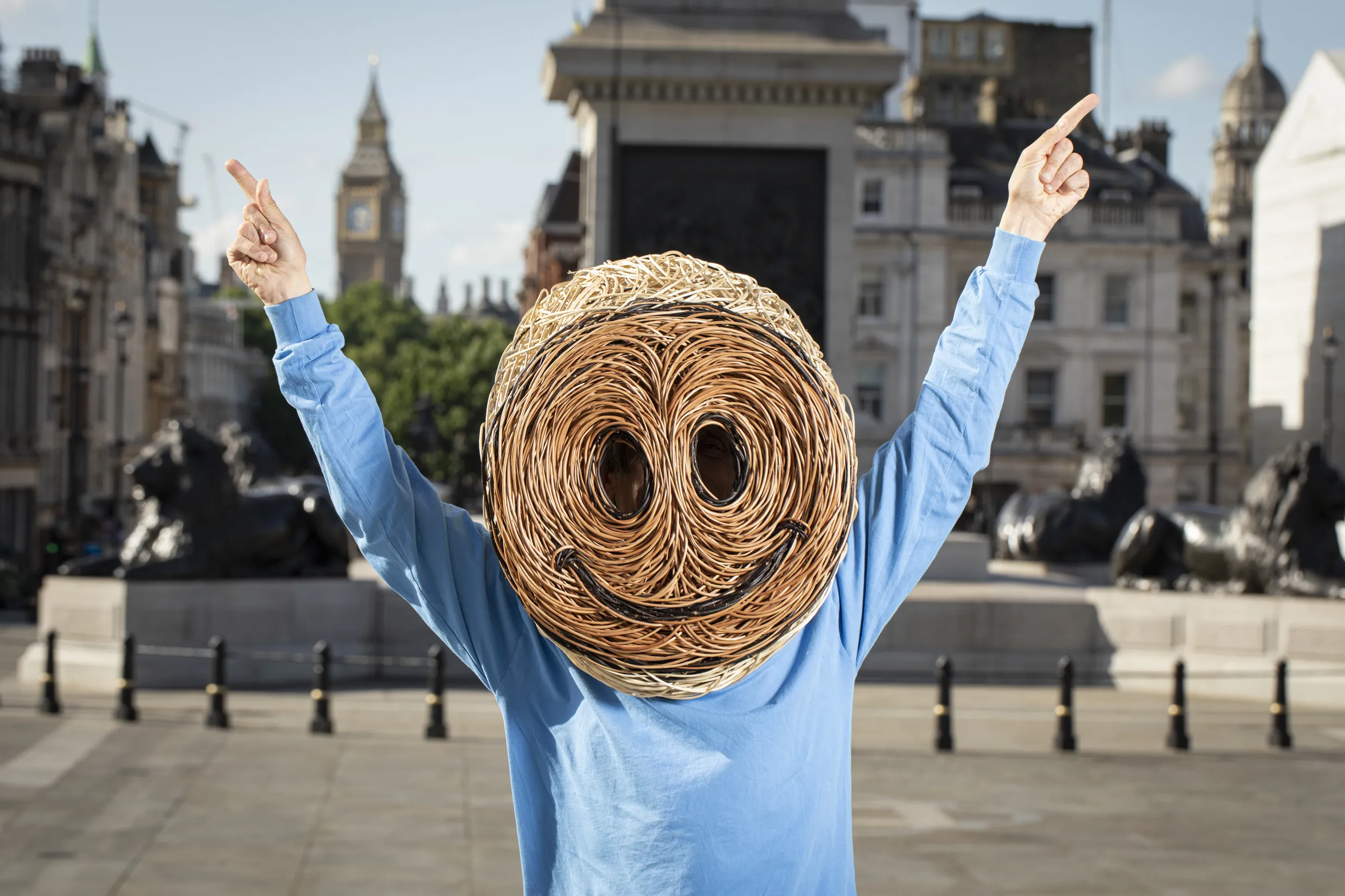 Jeremy Deller in Trafalgar Square, wearing a willow head.