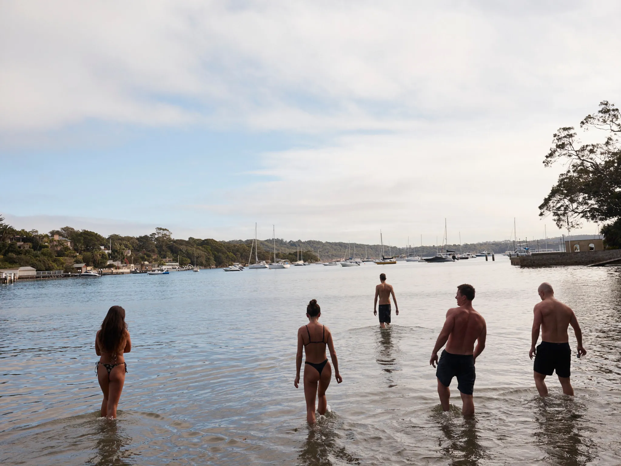 People dipping in ocean