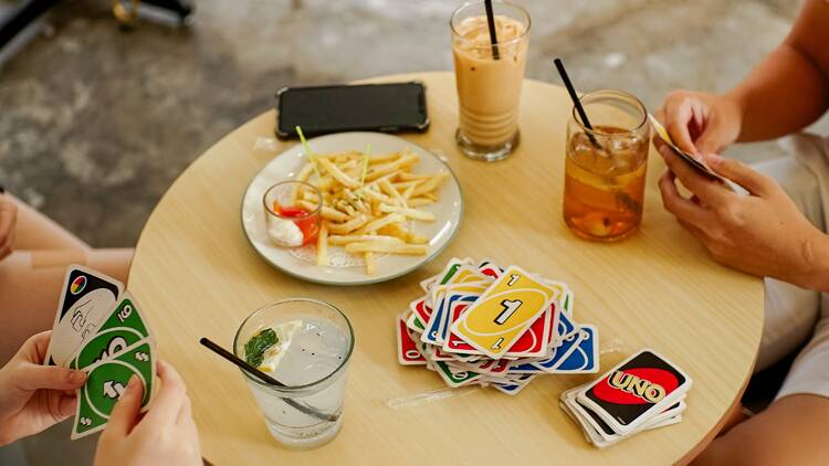 Bargoers playing Uno