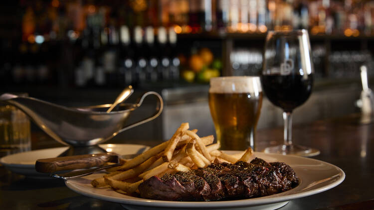Steak frites, a pint and a glass of wine