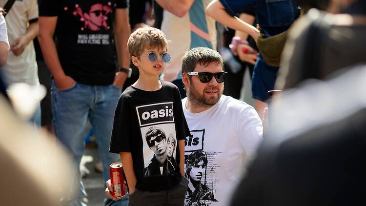 Oasis fans in Cardiff, UK