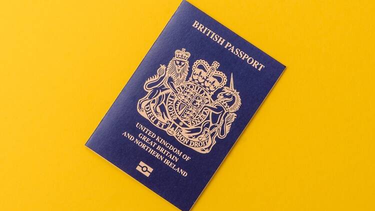 UK passport on yellow background
