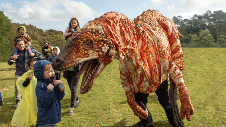 Dinosaur roaring at a child