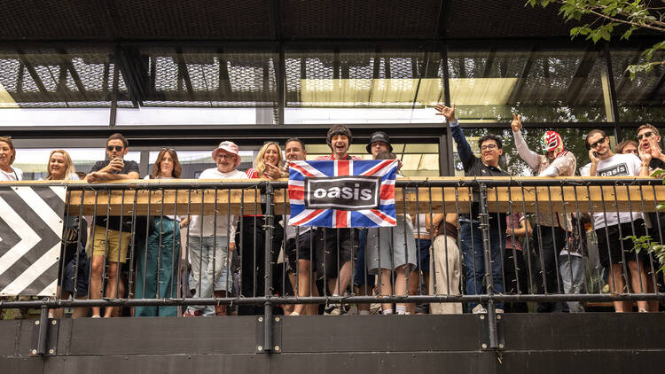 Oasis fans at Wembley Stadium in London for the reunion shows, by Chris Bethell