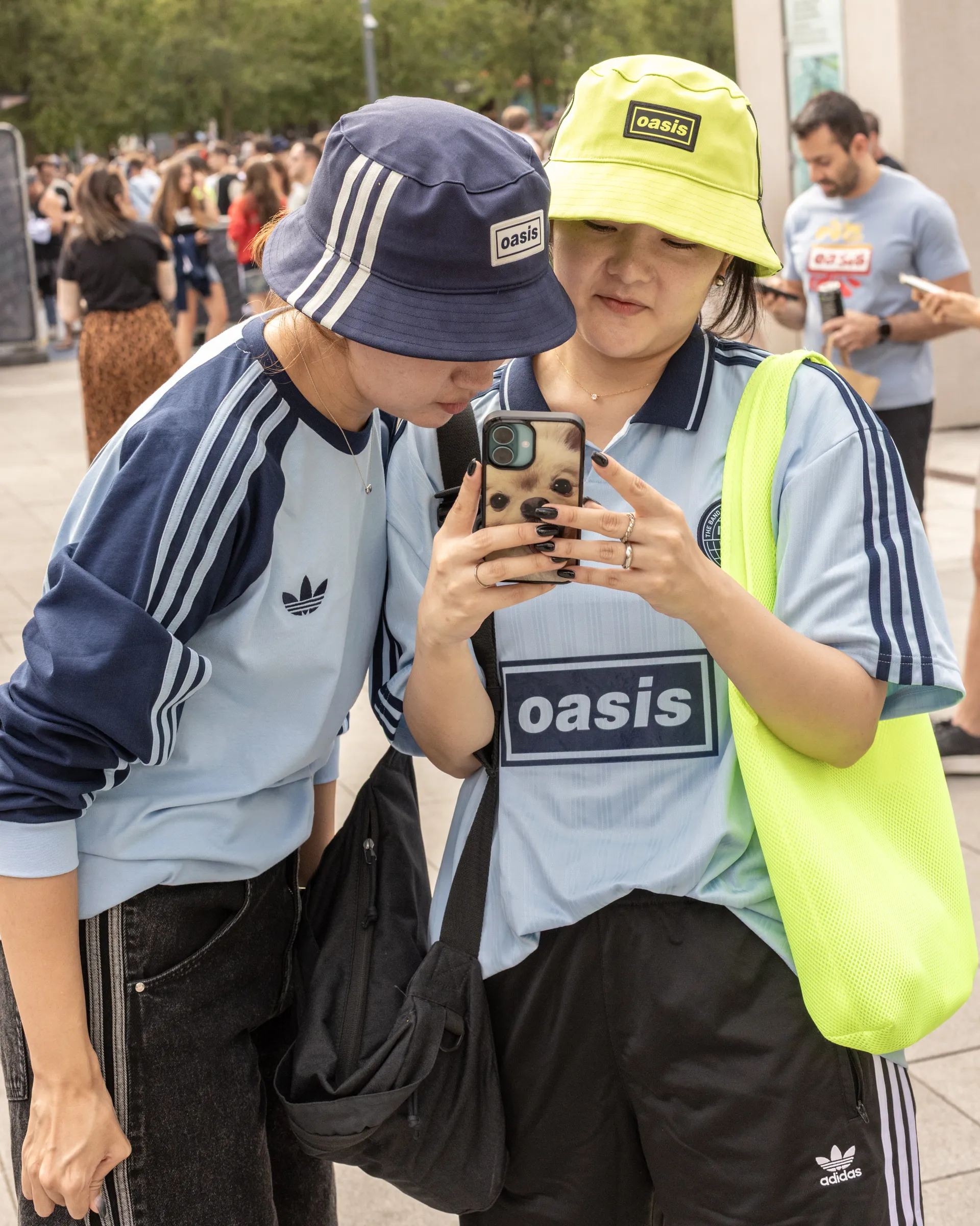 Oasis fans at Wembley Stadium in London for the reunion shows, by Chris Bethell