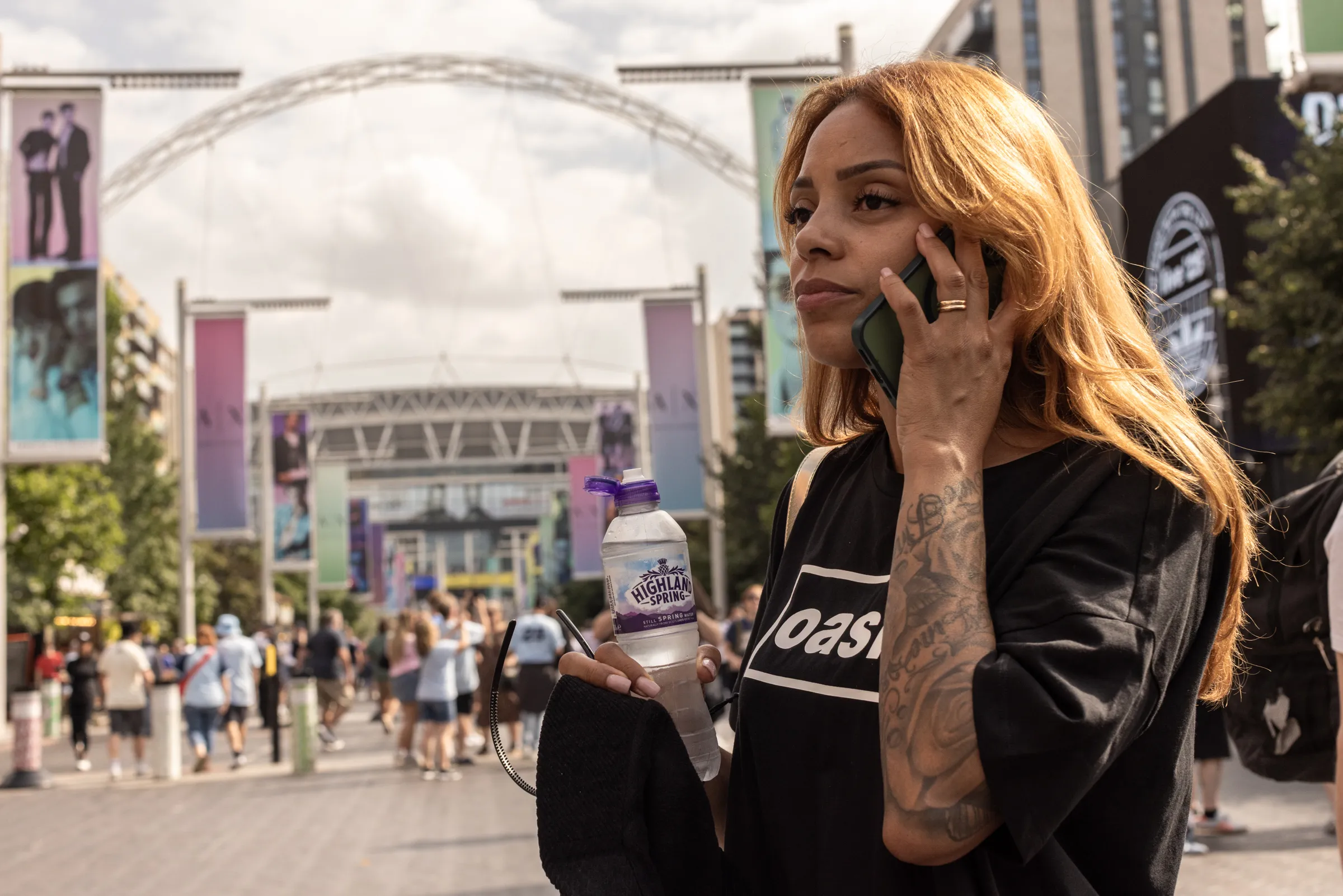 Oasis fans at Wembley Stadium in London for the reunion shows, by Chris Bethell