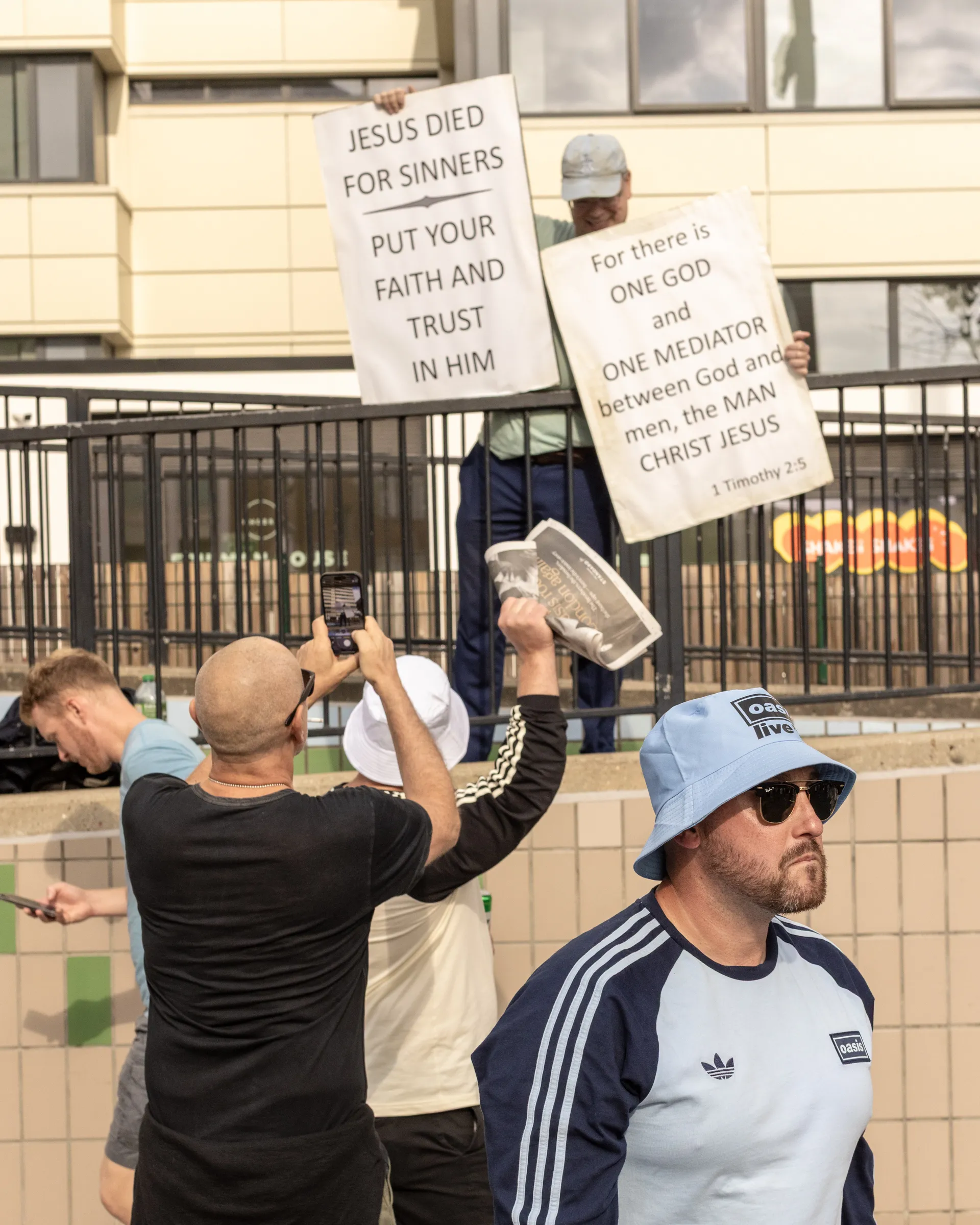 Oasis fans at Wembley Stadium in London for the reunion shows, by Chris Bethell