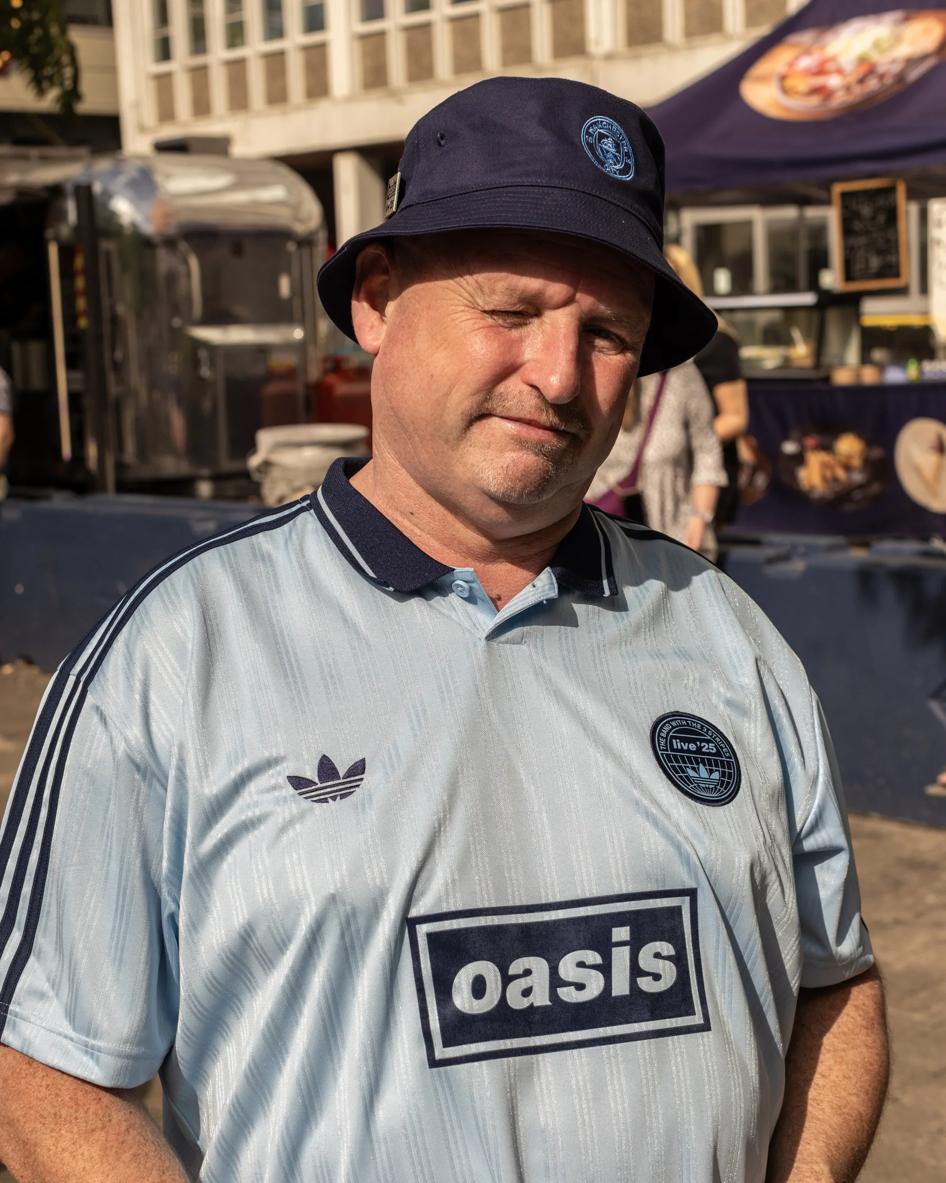Oasis fans at Wembley Stadium in London for the reunion shows, by Chris Bethell