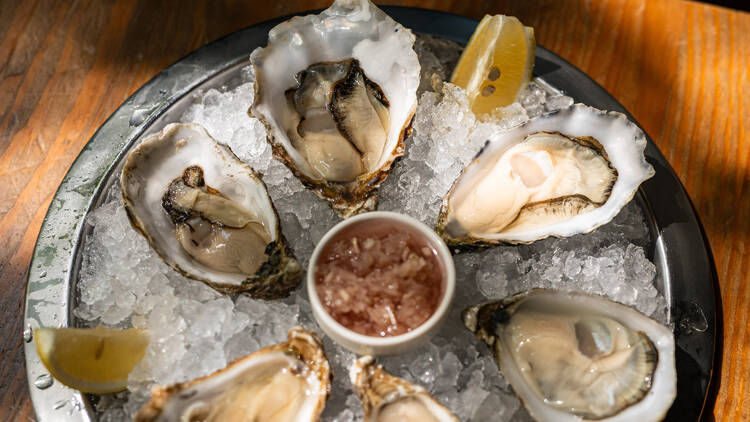 A selection of freshly shucked oysters on ice, served with lemon and mignonette — a true showcase of Bigfish’s seafood expertise.