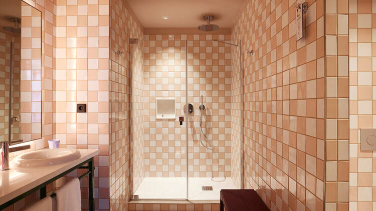 Pink and white chequered bathroom at Mama Shelter Nice