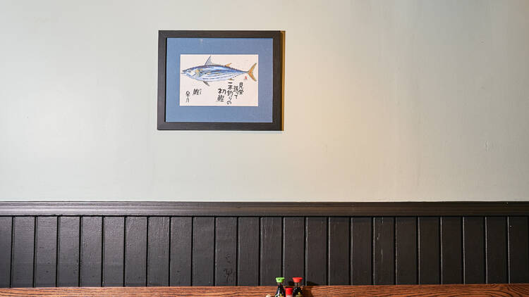 A Japanese artwork on the wall at Judy's Bay in Cambridge shows a large blue efish