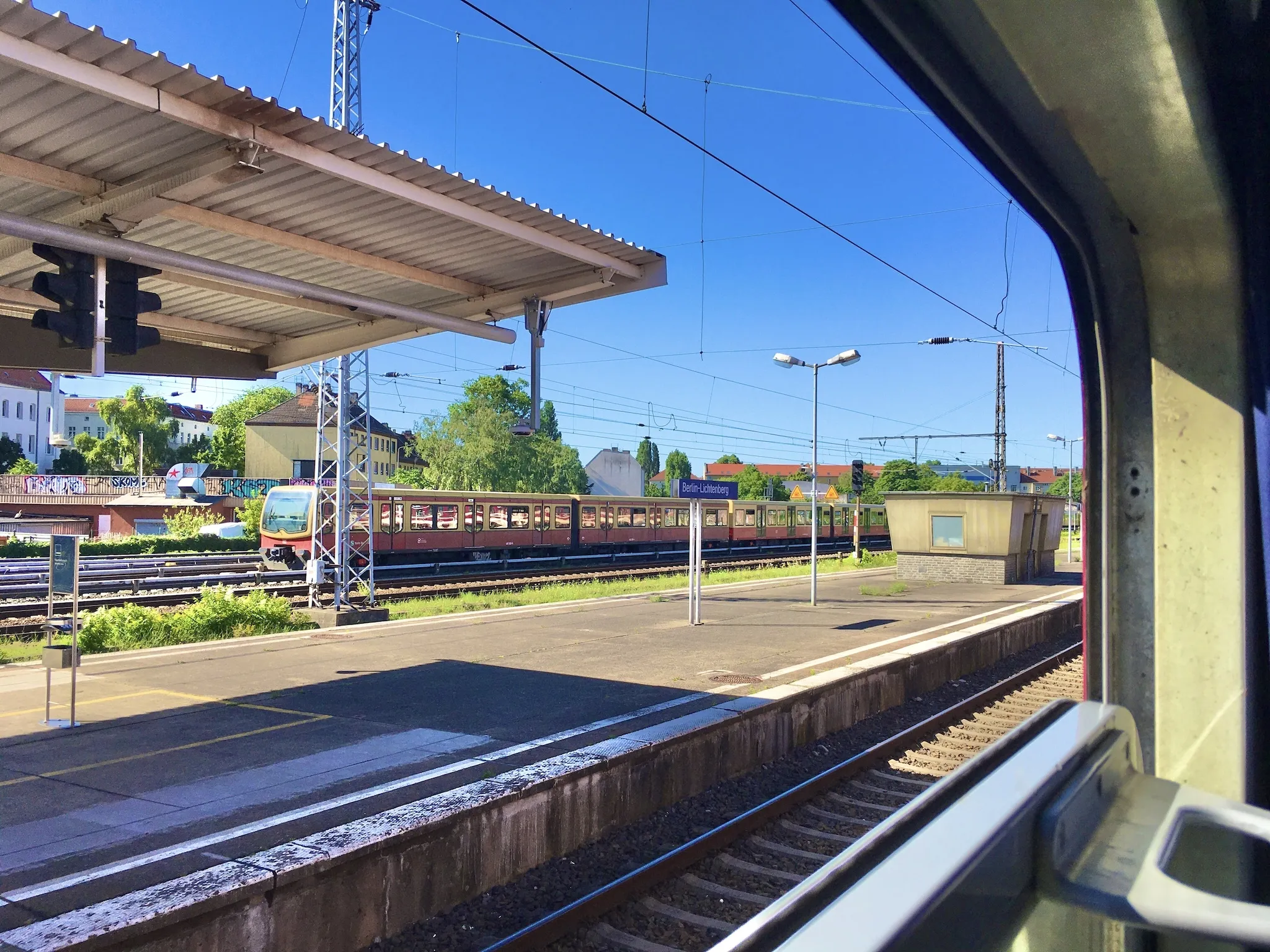 A Berlin train station platform from the window of the European Sleeper