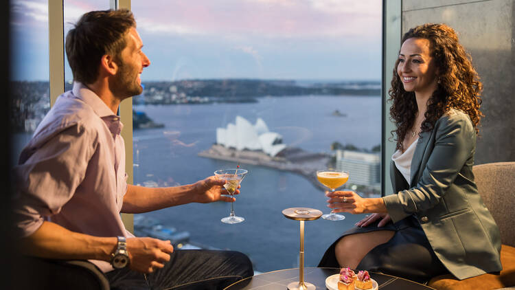 A couple dining at Shangri-La Sydney with harbour views